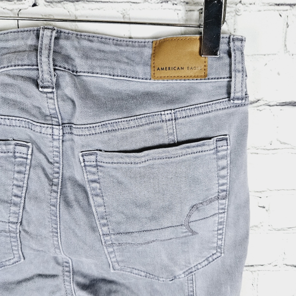 AMERICAN EAGLE | Hi-Rise Jegging exposed button fly skinny stretch jeans